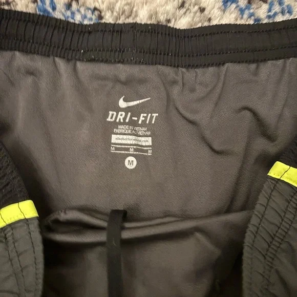 Nike Women's Black Shorts with Neon Yellow Trim - Picture 2 of 3